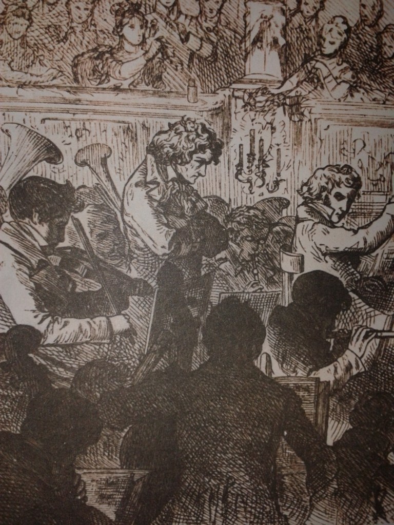 A 19th Century print depicting the first Performance of Beethoven's 9th symphony with Beethoven drawn in the middle of his orchestra. Wikipedia Commons